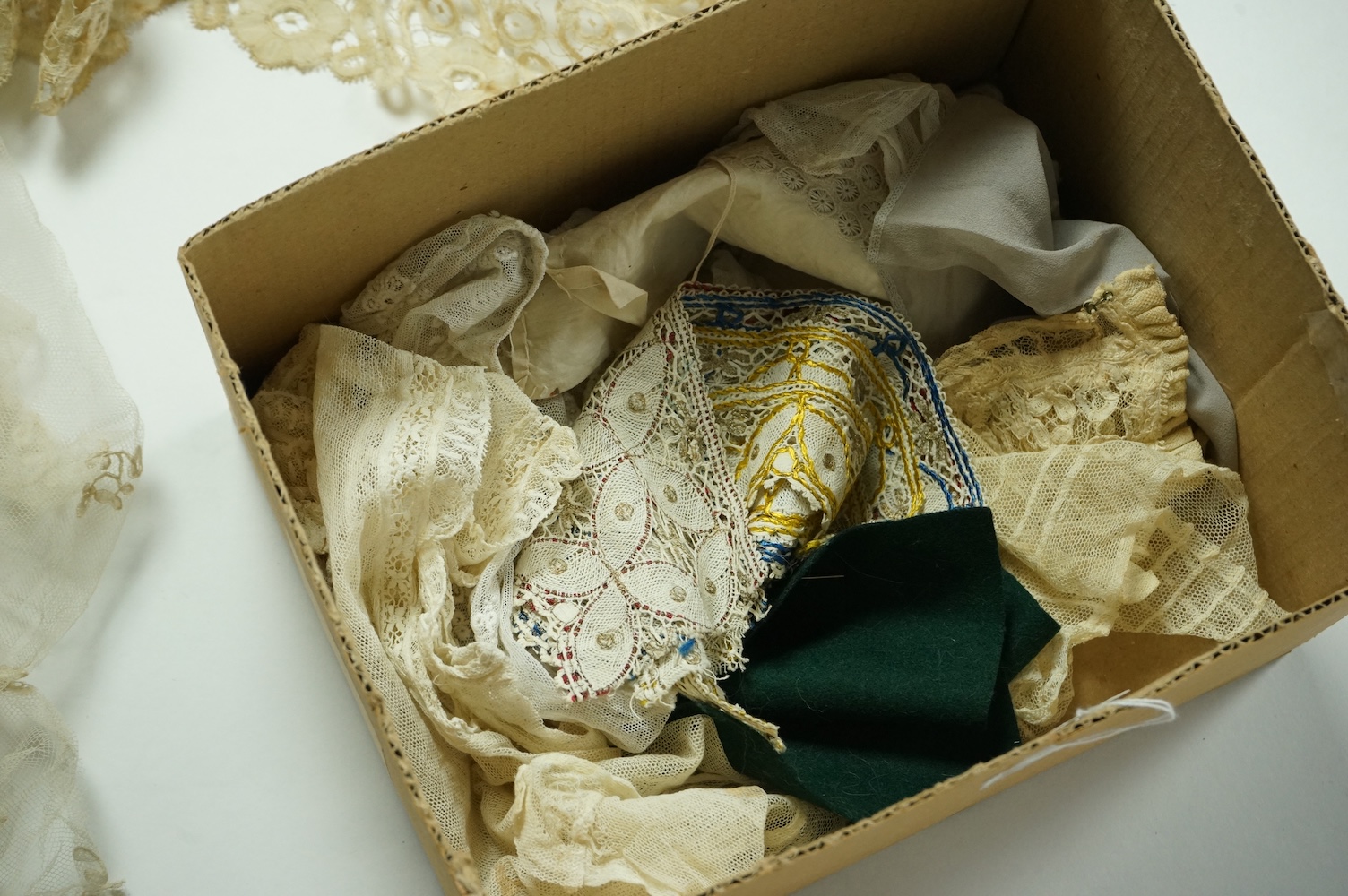 A Honiton lace wedding veil, (that has been cut into pieces), a Honiton edged collar, white worked jabot, various lace hankies etc. condition variable, very useful for theatre and film costume dramas.